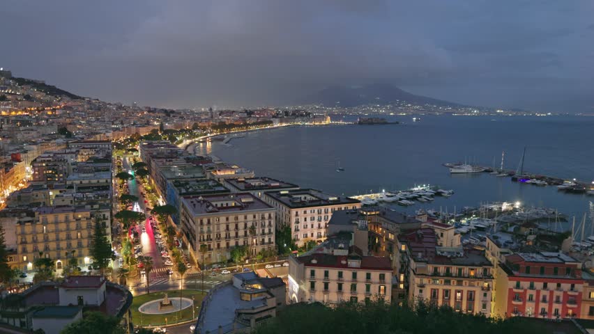 Panning HDR shot off night Naples, Italy. Old part of Naples city with embankment and views of Vesuvius | Shutterstock HD Video #1111726487