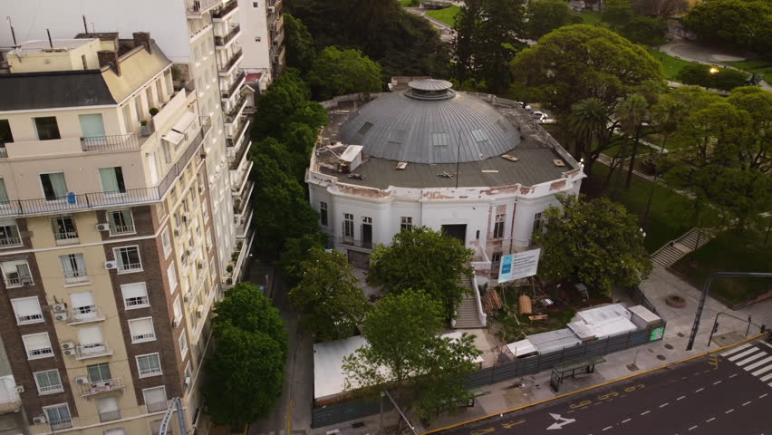 View of an unusual historical building under renovation in the city of Buenos Aires, renovation work, fenced, round dome