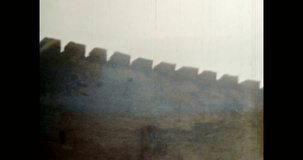 Defensive wall panorama of medieval castle in spring. High impregnable wall of fort outdoors. historic Fortress architecture. Ancient Europe landmark. Vintage footage of archival film. 1980s archive