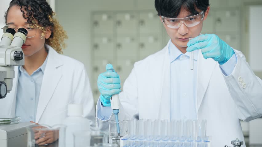 Multinational researcher group experimenting in the lab. Research and Development. | Shutterstock HD Video #1111734657