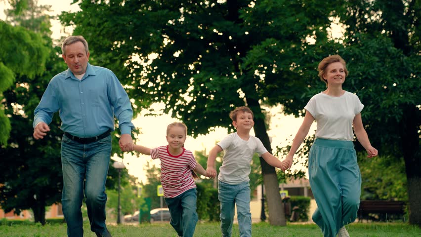 Children, mom dad playing, kids in nature. Family game Concept, father mother daughter son fun running. Happy family team, children, parents, run together in park on grass. Weekend play, holiday kids Royalty-Free Stock Footage #1111752197