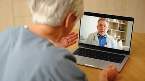 Senior man doctor expert examining older senior woman online. Old woman lady patient and doctor talk on video call have consultation with laptop. Medicine healthcare medical checkup. Online doctor