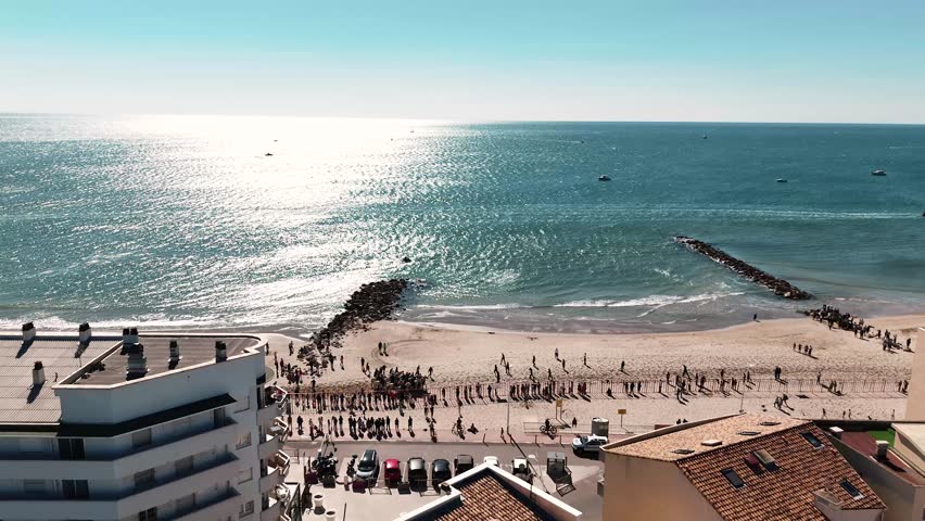 Aerial view revealing horseback rides on the beach of Palavas Les Flots as part of the citys autumn fair, Herault, France. | Shutterstock HD Video #1111752949