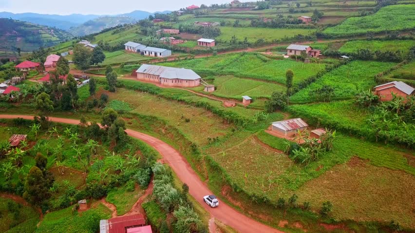 Vehicle Traveling Through Scenic Landscape In Uganda, Africa - aerial drone shot | Shutterstock HD Video #1111752955