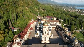 New Athos Monastery in Abkhazia, the city of New Athos, drone footage, autumn green hills 