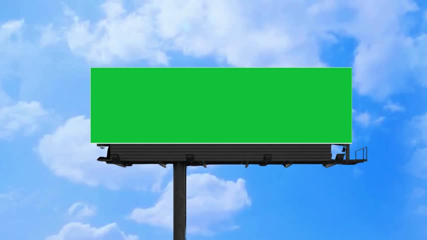 Large, empty billboard with a green screen for advertising against a time-lapse of the sky and clouds