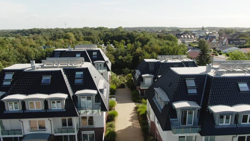 "Aerial view of 4 cozy vacation homes grouped together in Northern Germany." Royalty-Free Stock Footage #1111756269