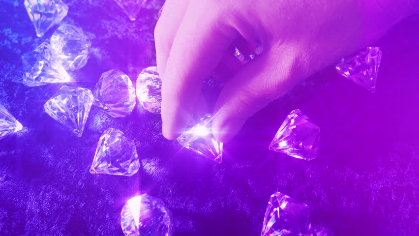 Diamond Is Picked Up In Colorful Lights | Shutterstock HD Video #1111760531