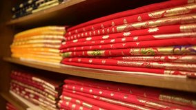 Handmade Indian silk sari or Banarasi saree with beautiful texture and hand work on it placed together in store for showcase. - Powered by Shutterstock - Get 15% off with code: PIKWIZARD15