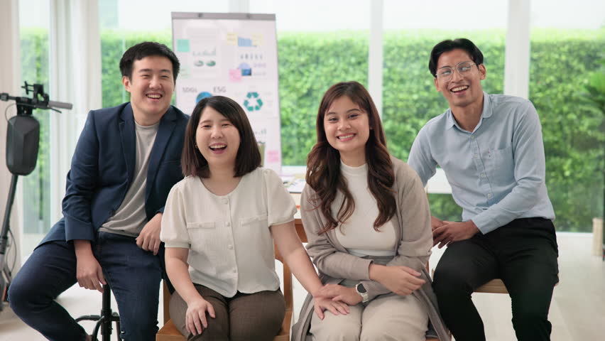 Save the earth planet climate change social ESG support office net zero waste go green unity diverse asian team. Group SDGs asia Gen Z people happy health workforce smiling relax joy looking at camera | Shutterstock HD Video #1111762821