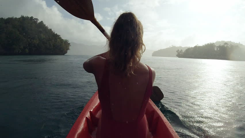 Woman, back and water with rowing kayak, freedom and lake in sustainable transportation, fitness and oar. Canoeing, girl and training in nature, river and outdoor by tropical jungle for vacation | Shutterstock HD Video #1111766863