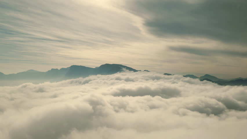 Drone, sky and clouds of nature, heaven or new dawn in mysterious, beautiful and natural land. Serene, calm aerial view of peaceful cloudy mist and magical or natural scenery on earth, weather. | Shutterstock HD Video #1111766877