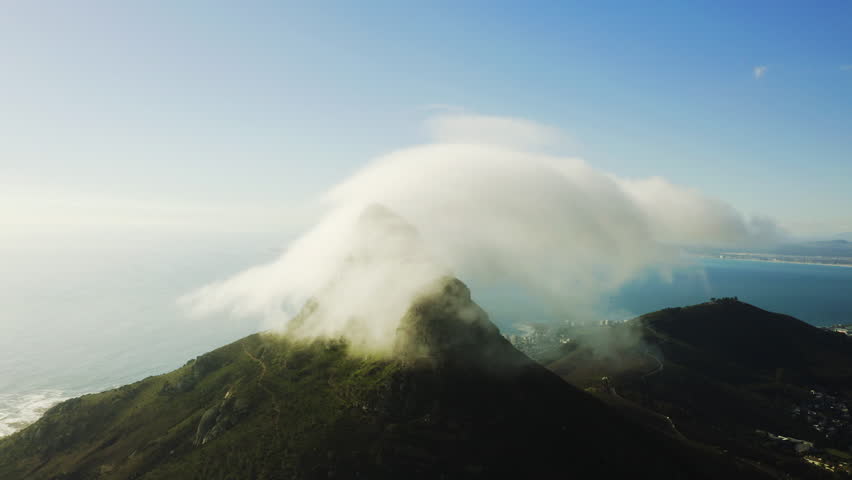 Mountain, clouds in sky and horizon from drone with nature, sea and remote travel location. Landscape, peak and climate in natural environment with ocean, green hill and sustainable tropical island. | Shutterstock HD Video #1111766883