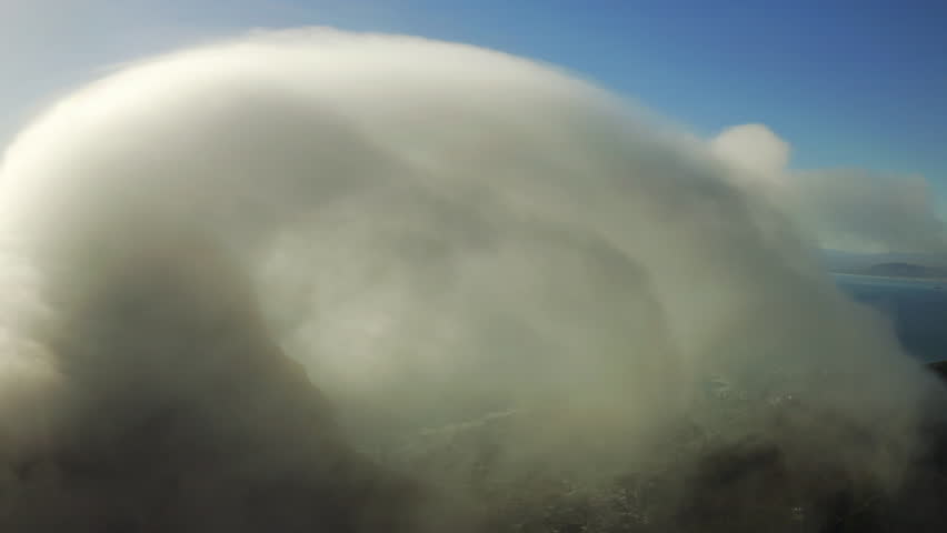 Mountain, clouds in blue sky and sea from drone with nature, ocean fog and remote travel location. Landscape, peak and climate in natural environment with water, hill and tropical island weather. | Shutterstock HD Video #1111766921