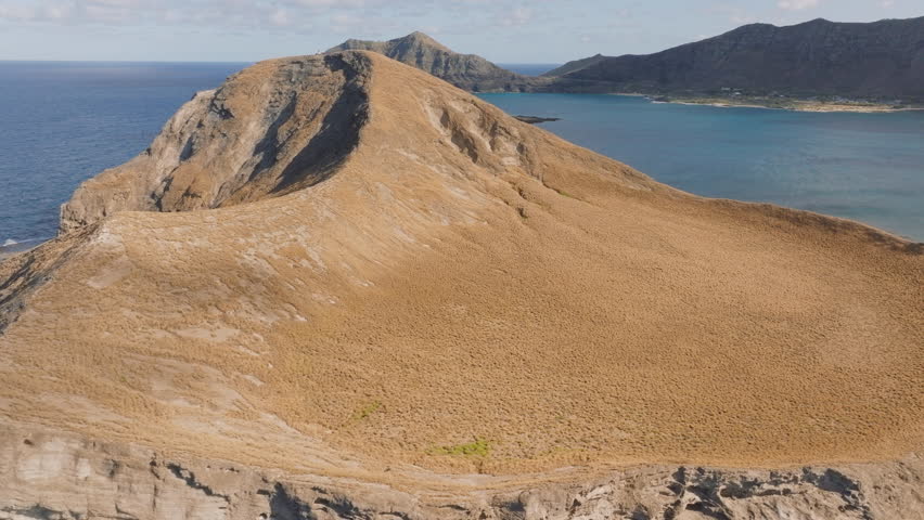Rocky island in Pacific ocean surrounding Oahu island. Epic views of Manana island Hawaii nature. Cinematic landscape of scenic island in blue waters. Beautiful nature background copy, Waimanalo bay