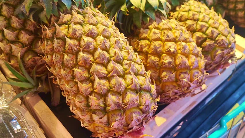 hypermarket in the fruit section. Vegetarianism and healthy eating concept. dragon fruit, pineapple Royalty-Free Stock Footage #1111770365