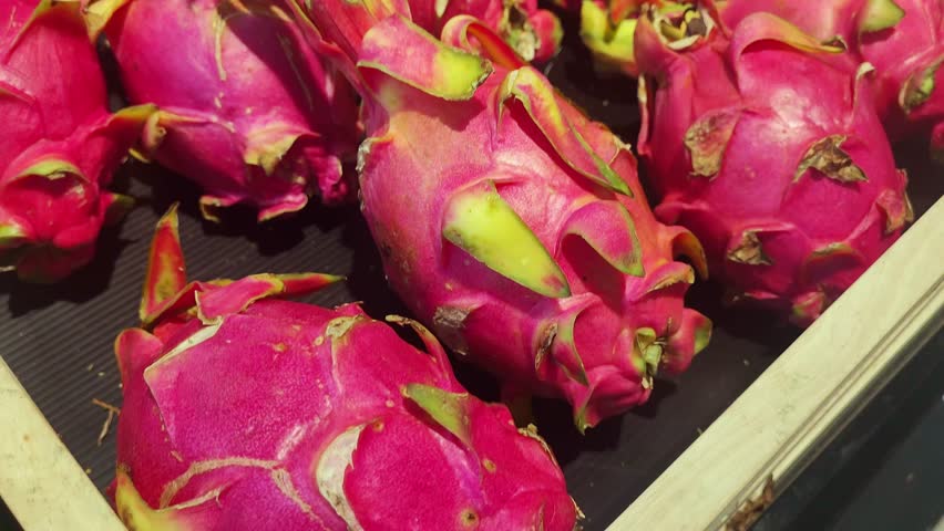 hypermarket in the fruit section. Vegetarianism and healthy eating concept. dragon fruit, pineapple Royalty-Free Stock Footage #1111770369