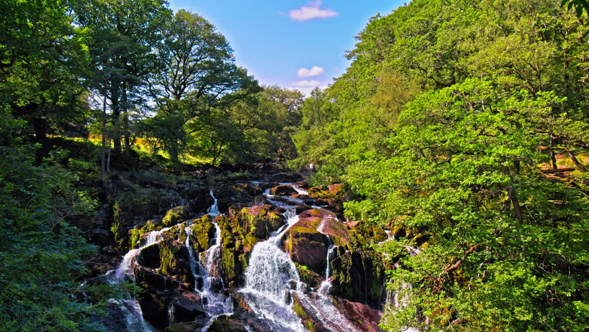 Rhaeadr Ewynnol Swallow Falls Waterfall, Tourist attraction in Wales. Churning waterfalls in a picturesque, wooded setting, reachable by a narrow, rocky footpath.