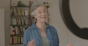 Senior Adult Female at Home Talking to Camera with Technology