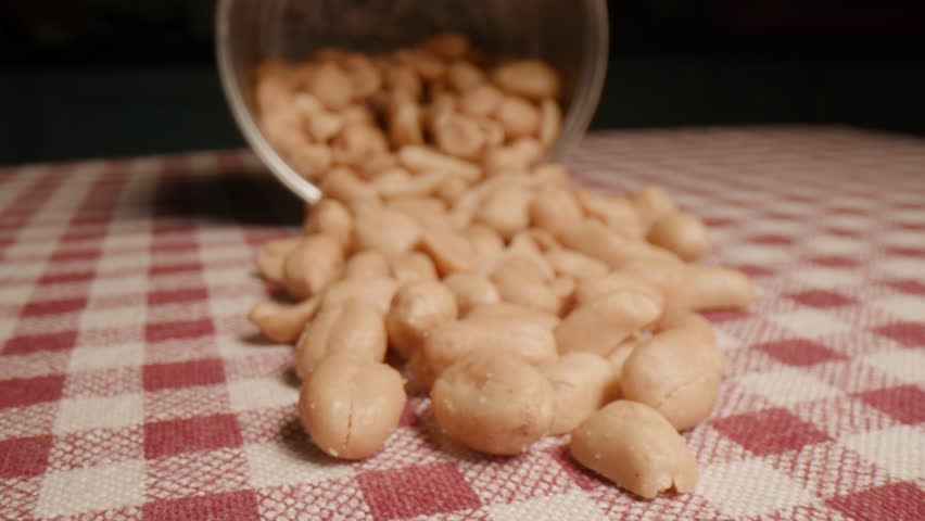 Roasted Peanuts Pile on the Table, Dolly Macro Shot. | Shutterstock HD Video #1111775609