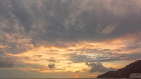 time lapse beautiful clouds are moving slowly in the colorful sky at sunset..Nature video High quality footage. Meditation ocean and sky background..Majestic sunset or sunrise cloudscape background.