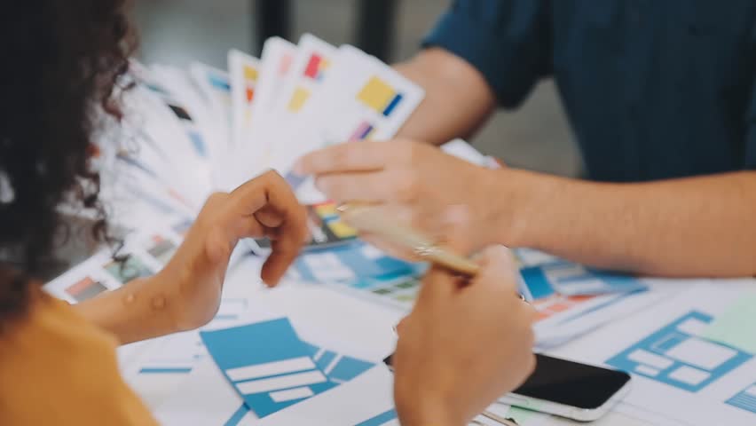 Team of Creative Web Graphic Designer planning, drawing website ux app for mobile phone application and development template layout, process to developing prototype wireframe, User experience concept. | Shutterstock HD Video #1111779323
