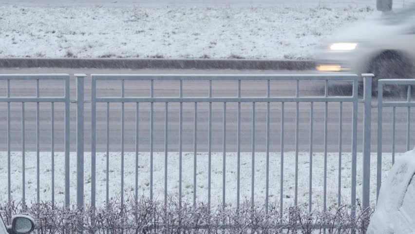First snow falling on the road and fence in winter | Shutterstock HD Video #1111783465