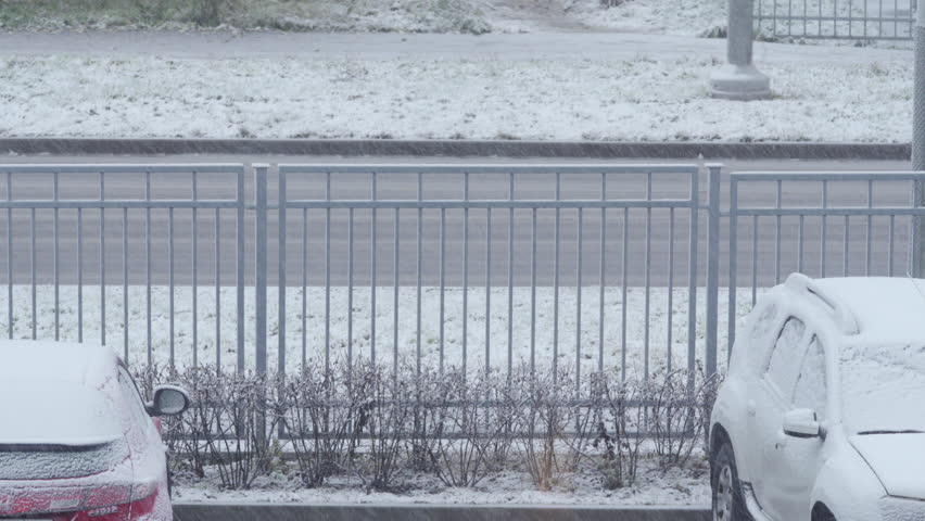 First snow falling on the road and fence in winter | Shutterstock HD Video #1111783467