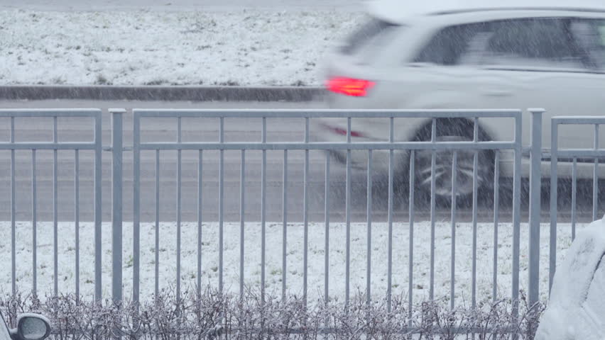 First snow falling on the road and fence in winter | Shutterstock HD Video #1111783469