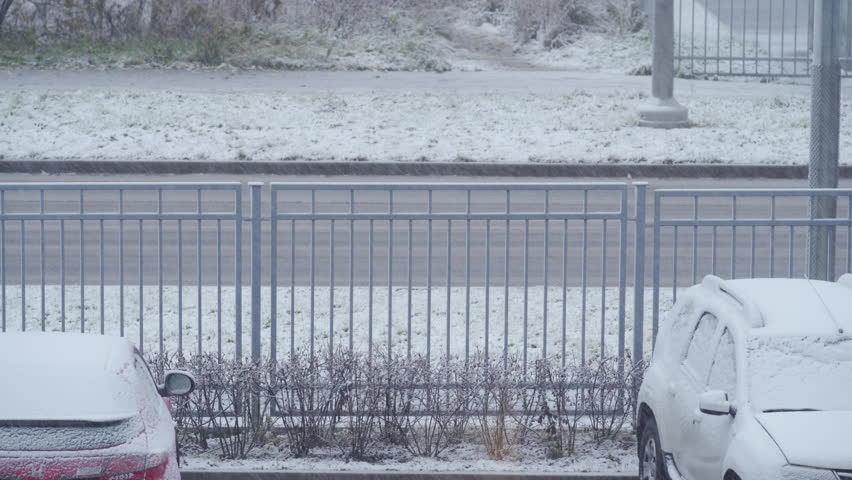 First snow falling on the road and fence in winter | Shutterstock HD Video #1111783475