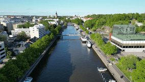 Aerial forward movement over Aurajoki in Turku, Finland on a summer day