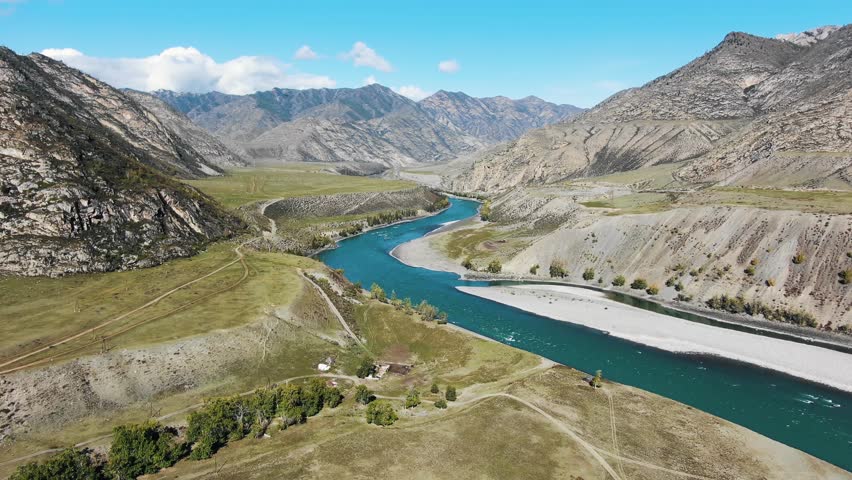 River flows through mountainous area. Stunning breathtaking amazing views of immaculate nature, high majestic mountains, azure clear body of water flowing through canyon. Aerial top drone view | Shutterstock HD Video #1111785227