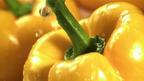 Drops of water fall on sweet peppers. Macro shot. Filmed on a high-speed camera at 1000 fps. High quality FullHD footage - Powered by Shutterstock - Get 15% off with code: PIKWIZARD15