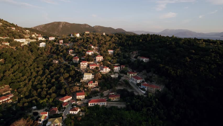 Seaside town in Greece. Aerial view of the seaside town on a sunset.