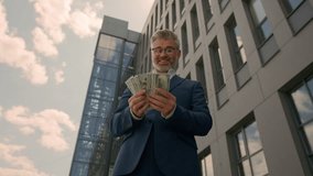 Happy joyful success rich wealthy old senior Caucasian man mature employer business entrepreneur businessman in city downtown throw money rain in air flying banknotes cash celebrate financial achieve - Powered by Shutterstock - Get 15% off with code: PIKWIZARD15
