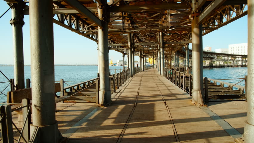 HUELVA, Spain, 17 OCTOBER 2023 - Sunset at Rio Tinto Pier, also known as Muelle de Rio Tinto, Huelva, Andalucia, Spain, commercial pier used for the trade of material from the mines of the Rio Tinto
