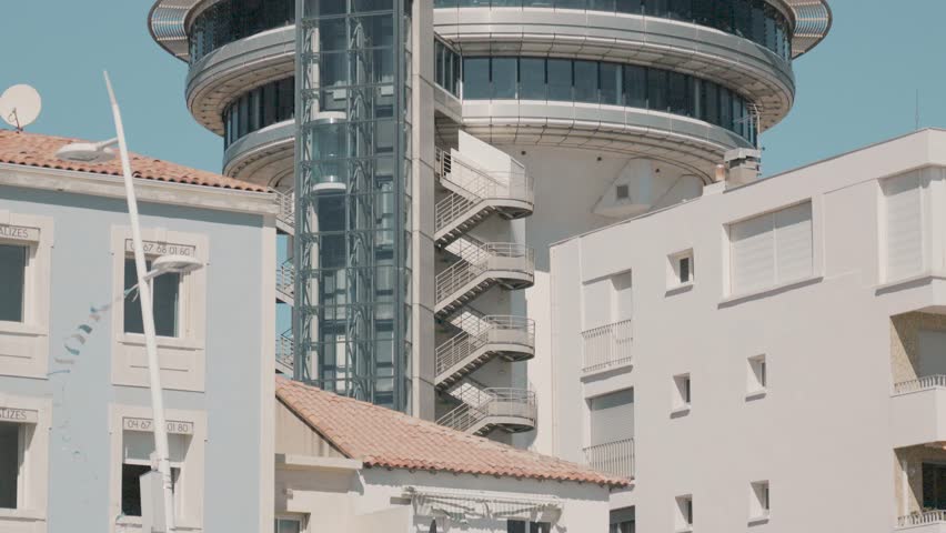 Slow motion tilting shot showing the beautiful Phare de la Méditerranée | Shutterstock HD Video #1111792993