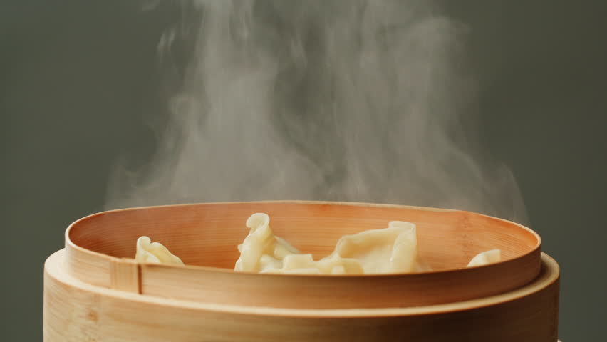 Japanese gedza on wooden steamer close-up. Fried dumplings with meat. Steaming Technique. Cooking at cafe, restaurant. Homemade. Delivery Royalty-Free Stock Footage #1111793795