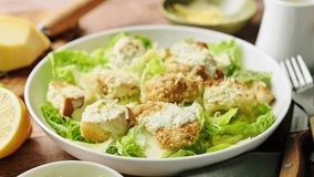 Caesar salad. Classic Caesar salad with romaine lettuce, croutons, baked chicken fillet, Parmesan cheese and dressed with sauce