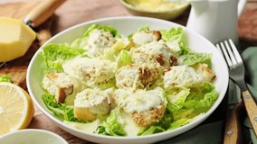 Caesar salad. Classic Caesar salad with romaine lettuce, croutons, baked chicken fillet, Parmesan cheese and dressed with sauce