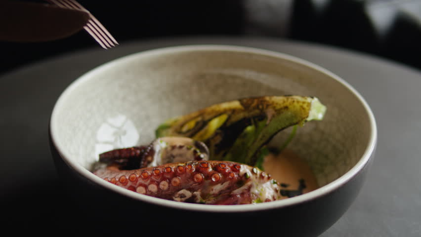 Grilled octopus in modern restaurant with steamed vegetables broccoli, japanese cuisine, man grill seafood with boiling water, boiled steamed octopus, spanish mediterranean restaurant, s Royalty-Free Stock Footage #1111793921