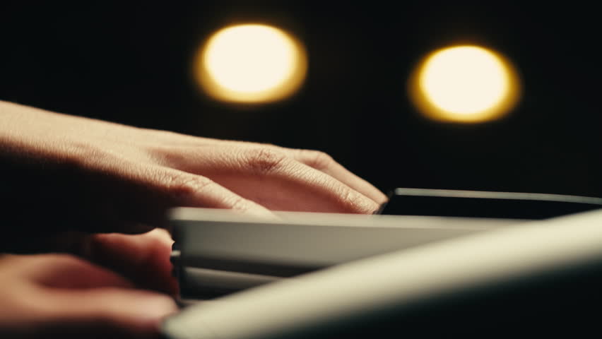 Young woman pianist playing classical music on a grand piano close-up. Classic music concert or repetition | Shutterstock HD Video #1111793931