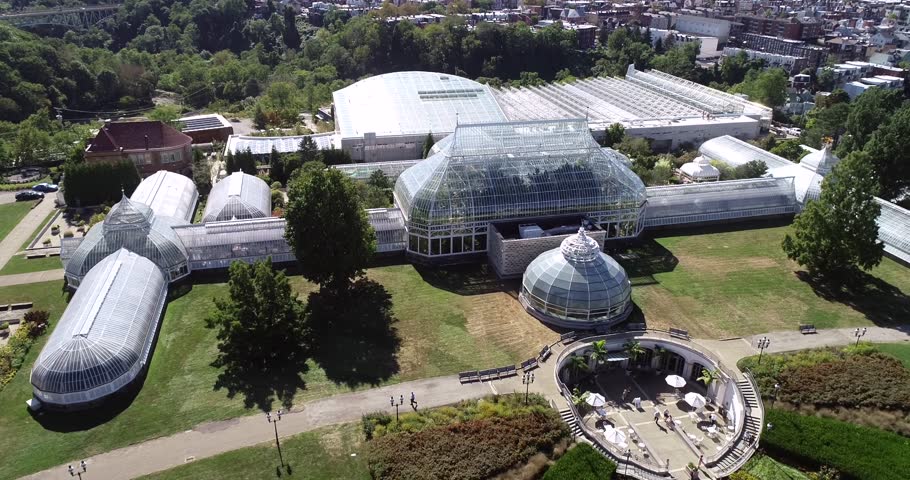 Phipps Conservatory and Botanical Gardens in Pittsburgh, Pennsylvania, United States. Schenley Park's horticulture hub features botanical gardens and a steel glass Victorian greenhouse Royalty-Free Stock Footage #1111796163