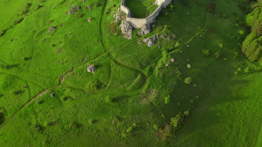 Aerial view of the Spis castle at sunrise, Unesco World Heritage Site, Slovakia. Spissky hrad medieval castle. Spis Castle in the town of Spisske Podhradie in Slovakia. Drone revealing footage
