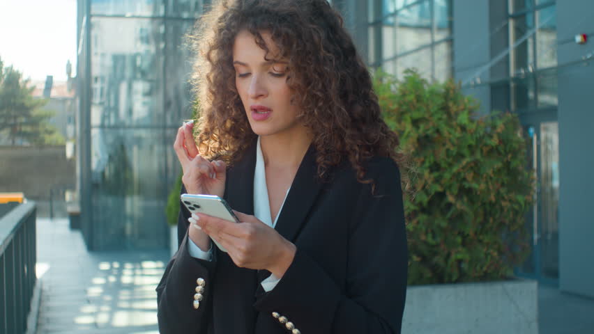 Caucasian young 20s hopeful businesswoman wish hope crossed fingers praying gesture ask god begging wishing luck in city outdoors worried upset business woman mobile phone failure bad result loss fail | Shutterstock HD Video #1111797243