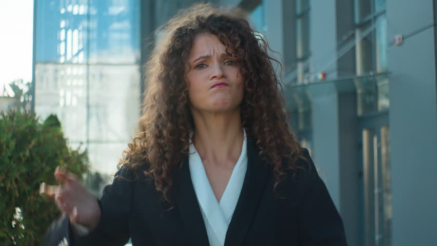 Outdoors business portrait female businesswoman young 20s angry annoyed lady in city irritated mad Caucasian woman girl dissatisfied complain anger rage stress expressing negative emotion annoyance | Shutterstock HD Video #1111797247
