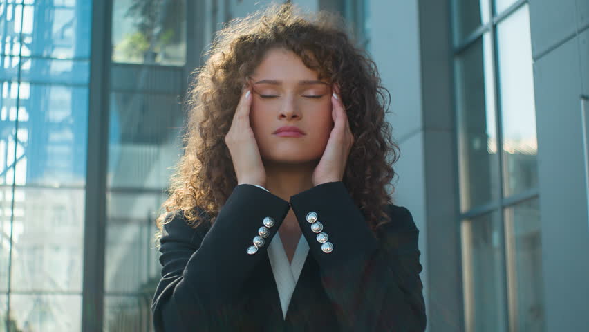 Unwell ill Caucasian business woman unhealthy overworked businesswoman feeling bad headache suffer in city sunny outdoors young exhausted tired girl office worker painful ache head problem medical aid | Shutterstock HD Video #1111797249