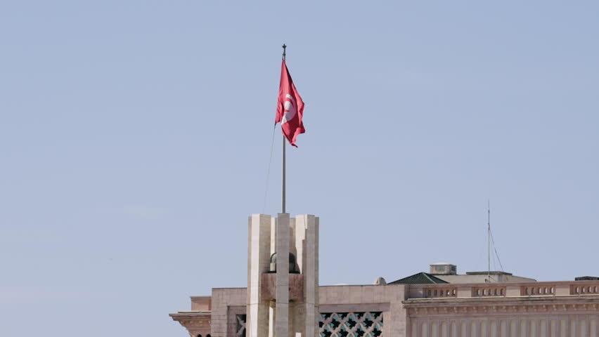 Tunisian Flag waving in front of the Municipality, Tunis , Tunisia | Shutterstock HD Video #1111797623