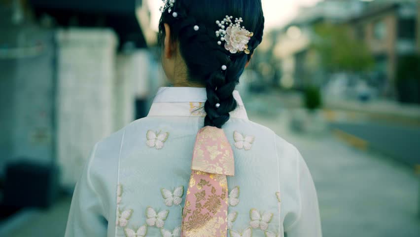 A graceful smile in traditional Hanbok at Changdeokgung palace, capturing the beauty of Korean culture