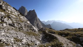 Descending from a Hiking Journey in High Mountains - Backpacker Adult Woman in Julian Alps Slovenia
